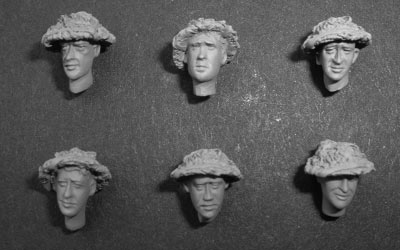 S2KF015 - British WWII heads with cammo helmets.